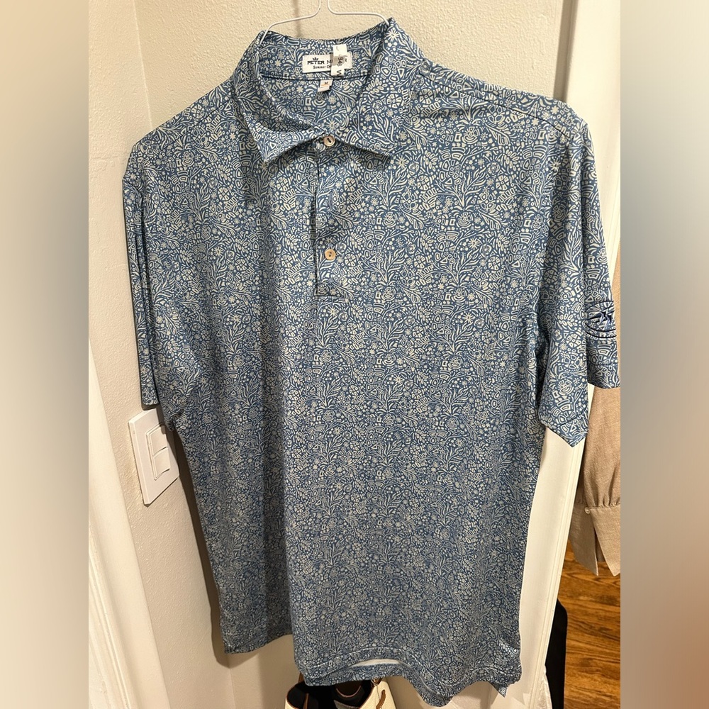 Peter Millar Polo with Castle Pines logo on sleeve